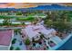 Beautiful aerial view of a single-story home with a tile roof located on a golf course at 2729 Echo Mesa Dr, Las Vegas, NV 89134