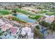 Aerial view of a single-story home with an adjacent golf course and water feature at 2729 Echo Mesa Dr, Las Vegas, NV 89134