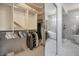 Walk-in closet leading to bright bathroom with soaking tub and stylish fixtures at 2729 Echo Mesa Dr, Las Vegas, NV 89134