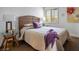 Comfortable bedroom with hardwood floors, a cozy bed, and bright natural light at 2729 Echo Mesa Dr, Las Vegas, NV 89134