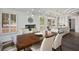 Open dining area features wood floors, modern lighting, and open-concept design at 2729 Echo Mesa Dr, Las Vegas, NV 89134