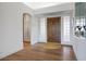 Inviting entryway featuring a wood front door, decorative glass panels, and a neutral color palette at 2729 Echo Mesa Dr, Las Vegas, NV 89134