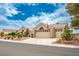 Charming single-story home featuring a two-car garage, manicured landscaping, and a tile roof at 2729 Echo Mesa Dr, Las Vegas, NV 89134
