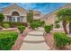 Charming home with landscaped front yard and welcoming walkway at 2729 Echo Mesa Dr, Las Vegas, NV 89134