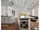 Spacious kitchen boasts a wine rack, granite countertops, and ample natural light at 2729 Echo Mesa Dr, Las Vegas, NV 89134