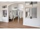 Open-concept living area with hardwood floors, recessed lighting, and architectural details at 2729 Echo Mesa Dr, Las Vegas, NV 89134