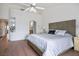 Comfortable main bedroom with a ceiling fan and access to a bathroom and closet at 2729 Echo Mesa Dr, Las Vegas, NV 89134