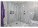 Modern shower featuring a frameless glass enclosure and stylish gray marble tile at 2729 Echo Mesa Dr, Las Vegas, NV 89134