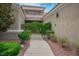 Inviting walkway leading to the entrance, surrounded by lush landscaping at 2729 Echo Mesa Dr, Las Vegas, NV 89134