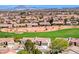 An aerial view showing the golf course and the neighborhood at 2734 Grand Forks Rd, Henderson, NV 89052