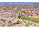 Aerial view of a neighborhood with the golf course visible and address labeled 2734 Grand Forks Rd at 2734 Grand Forks Rd, Henderson, NV 89052