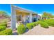 Charming covered back patio area with outdoor furniture and barbecue at 2734 Grand Forks Rd, Henderson, NV 89052