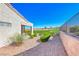 Picture of the backyard featuring a patio, desert landscaping, and golf course views at 2734 Grand Forks Rd, Henderson, NV 89052