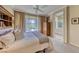 Bright bedroom with a view of the outdoor landscape through sun-filled windows at 2734 Grand Forks Rd, Henderson, NV 89052