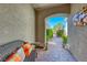Covered entryway with comfortable bench seating and decorative accents at 2734 Grand Forks Rd, Henderson, NV 89052