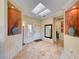 Elegant foyer featuring tile flooring, a skylight, and stylish decorative niches at 2734 Grand Forks Rd, Henderson, NV 89052