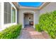 Warm and inviting front entrance with lush landscaping and a welcoming pathway at 2734 Grand Forks Rd, Henderson, NV 89052
