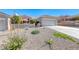 Charming single-story home featuring a low-maintenance gravel yard and a two-car garage at 2734 Grand Forks Rd, Henderson, NV 89052