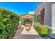 Inviting patio area with comfortable seating, sheltered by mature landscaping and a stylish umbrella at 2734 Grand Forks Rd, Henderson, NV 89052