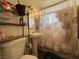 Cozy bathroom featuring a pedestal sink and a seashell-themed shower curtain at 2804 Marlin Ave, Las Vegas, NV 89101