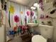 Cozy bathroom featuring a charming floral shower curtain, a modern vanity, and plants at 2804 Marlin Ave, Las Vegas, NV 89101