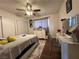 Comfortable bedroom with plush carpet, ceiling fan, closet and a dedicated vanity at 2804 Marlin Ave, Las Vegas, NV 89101
