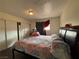 Bedroom features a large bed, sliding door closet, and soft natural light at 2804 Marlin Ave, Las Vegas, NV 89101