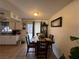 Cozy dining area features a dark wood table, tile floors, and natural lighting at 2804 Marlin Ave, Las Vegas, NV 89101