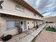 Two-story apartment complex with seating and plants at 2804 Marlin Ave, Las Vegas, NV 89101