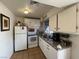 Charming kitchen features white cabinetry, modern appliances, and tile flooring at 2804 Marlin Ave, Las Vegas, NV 89101