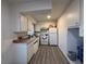 Compact kitchen with white cabinetry, and modern flooring at 2804 Marlin Ave, Las Vegas, NV 89101