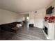 Spacious living room featuring modern flooring, a fireplace, and a comfortable sofa at 2804 Marlin Ave, Las Vegas, NV 89101