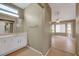 Bathroom featuring tile floors, vanity, large mirror and natural light at 2920 Crown Ridge Dr, Las Vegas, NV 89134