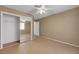 Bedroom with closet, ceiling fan, tile floors and neutral paint at 2920 Crown Ridge Dr, Las Vegas, NV 89134