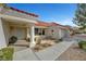 Attractive home with a well-maintained yard, neutral stucco, and a red tiled roof and covered porch at 2920 Crown Ridge Dr, Las Vegas, NV 89134