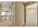 Wide hallway with tile flooring, closet and views to living space with neutral paint at 2920 Crown Ridge Dr, Las Vegas, NV 89134
