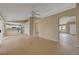 Open-concept living room featuring tile flooring, neutral paint, and easy access to the kitchen and other living areas at 2920 Crown Ridge Dr, Las Vegas, NV 89134