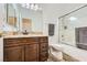 This bathroom includes a granite vanity top and a shower with a sliding glass door at 306 Saint Augustine Ln, Henderson, NV 89014