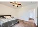 Comfortable bedroom with ceiling fan and neutral carpet, creates a tranquil retreat at 306 Saint Augustine Ln, Henderson, NV 89014