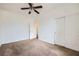 This bedroom features carpet flooring, closet space, and neutral paint at 306 Saint Augustine Ln, Henderson, NV 89014