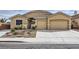 Charming single-story home with a well-maintained lawn and a spacious two-car garage at 306 Saint Augustine Ln, Henderson, NV 89014