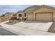 Beautiful single-story home featuring a spacious driveway and a two-car garage at 306 Saint Augustine Ln, Henderson, NV 89014