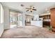Open-concept living area featuring a sliding glass door and connecting to the kitchen at 306 Saint Augustine Ln, Henderson, NV 89014