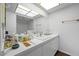 Vanity and mirror in a brightly lit bathroom at 3323 Maclyon Way, Las Vegas, NV 89121