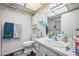 Bright bathroom featuring a shower/tub combo and a grey vanity at 3323 Maclyon Way, Las Vegas, NV 89121