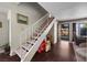 Bright entryway with stairs, wood flooring, and a view to the secure, gated front yard at 3323 Maclyon Way, Las Vegas, NV 89121