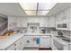 Cozy kitchen featuring white cabinetry, appliances, and countertops, offering a clean and functional space at 3323 Maclyon Way, Las Vegas, NV 89121