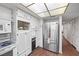 Bright kitchen featuring modern stainless steel refrigerator and ample storage in well-maintained cabinets at 3323 Maclyon Way, Las Vegas, NV 89121