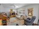 Inviting living room features comfortable seating, soft lighting, and view to the backyard at 3323 Maclyon Way, Las Vegas, NV 89121