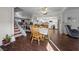 Cozy dining area leading to a kitchen featuring white cabinets and modern appliances at 3323 Maclyon Way, Las Vegas, NV 89121